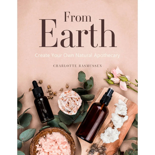 From Earth Create Your Own Natural Apothecary Book by Charlotte Rasmussen with essential oil bottles and natural ingredients