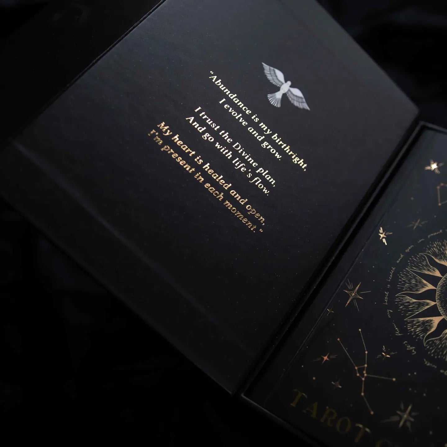 Dreamy Moons Tarot deck gold foil packaging with celestial designs and inspirational quote inside