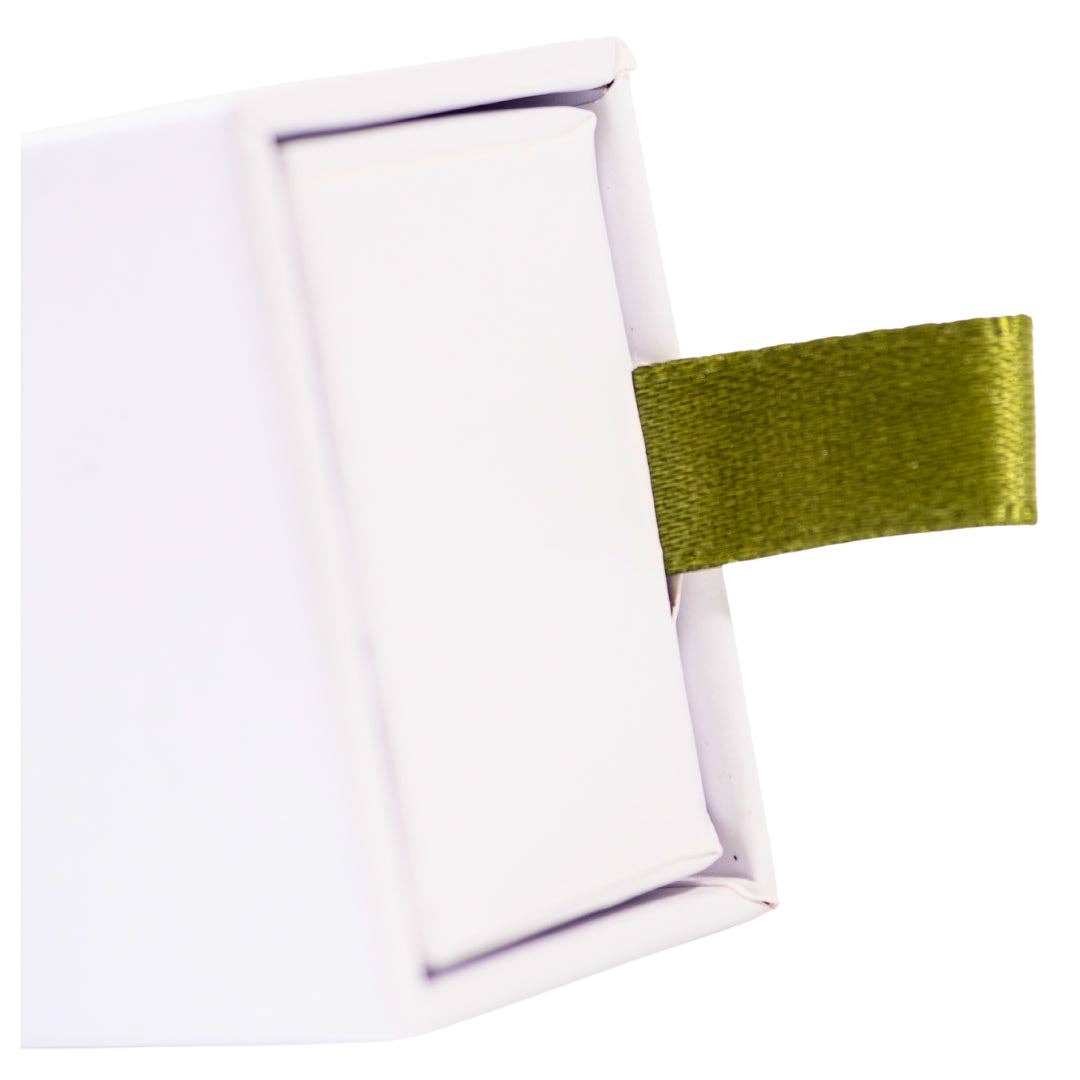 Cleanse cedarwood incense box with a green ribbon pull for easy opening