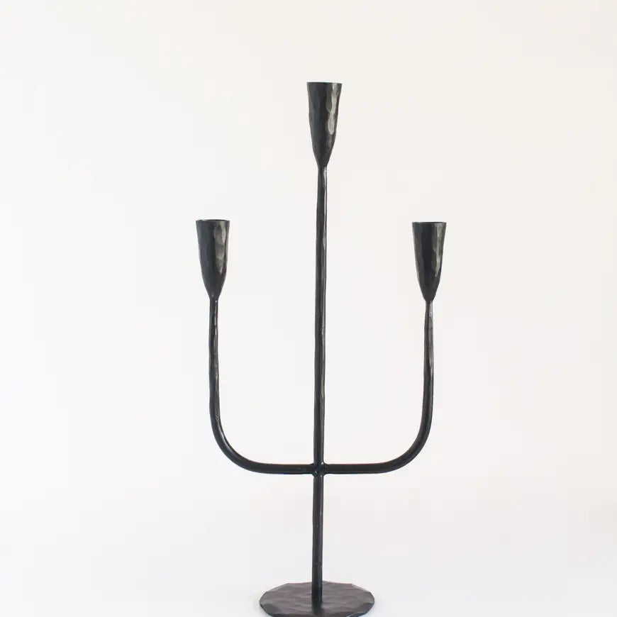 Gothic iron candelabra featuring three elegant candle holders for a dramatic decor statement