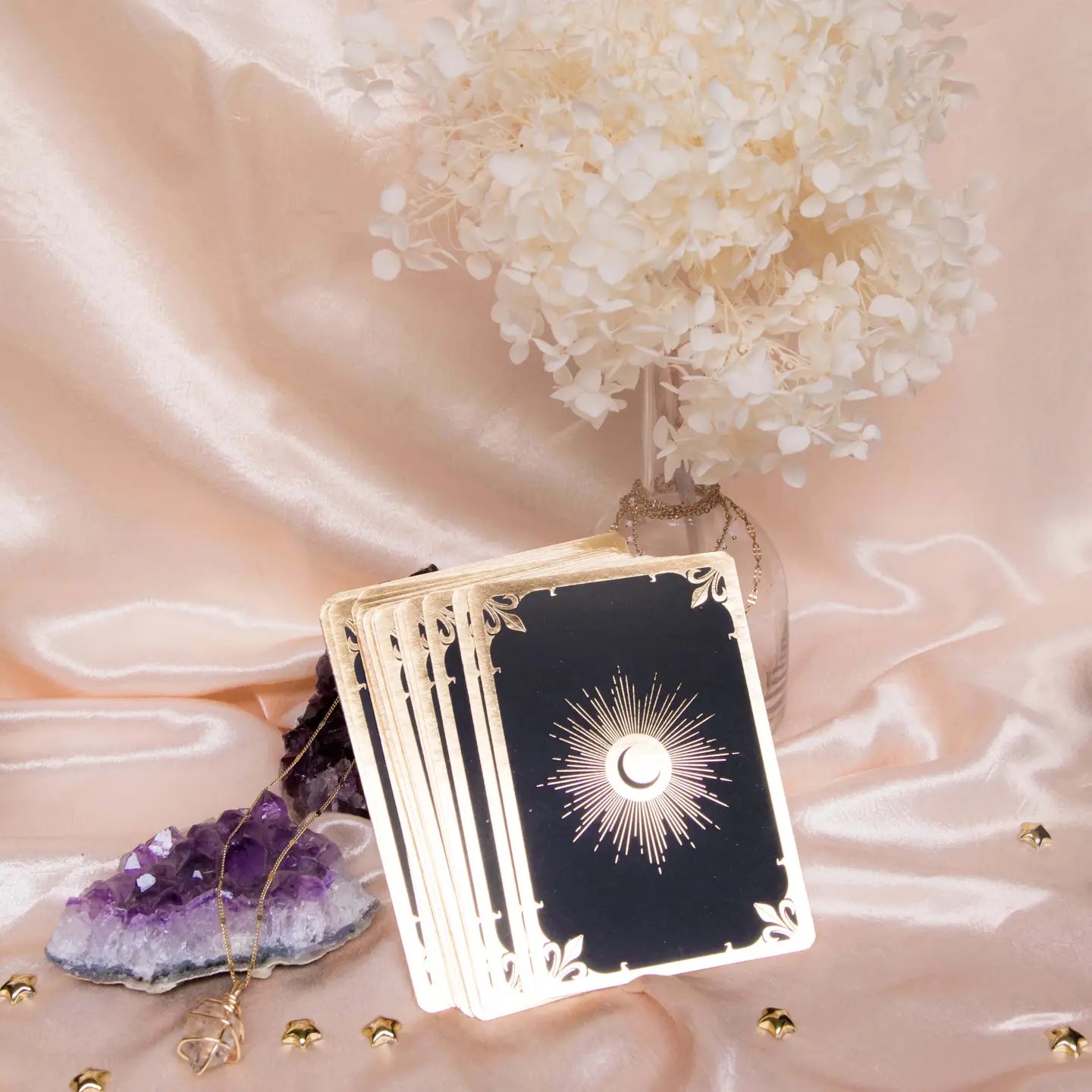 Dreamy Moons Soul Whispers Gold Foiled 33 Card Deck displayed with crystals and flowers
