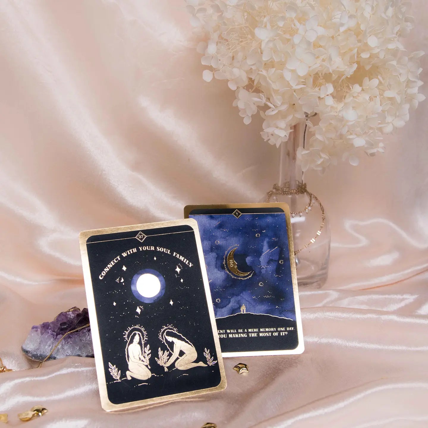 Dreamy Moons Soul Whispers Gold Foiled 33 Card Deck displayed with floral arrangement and crystals