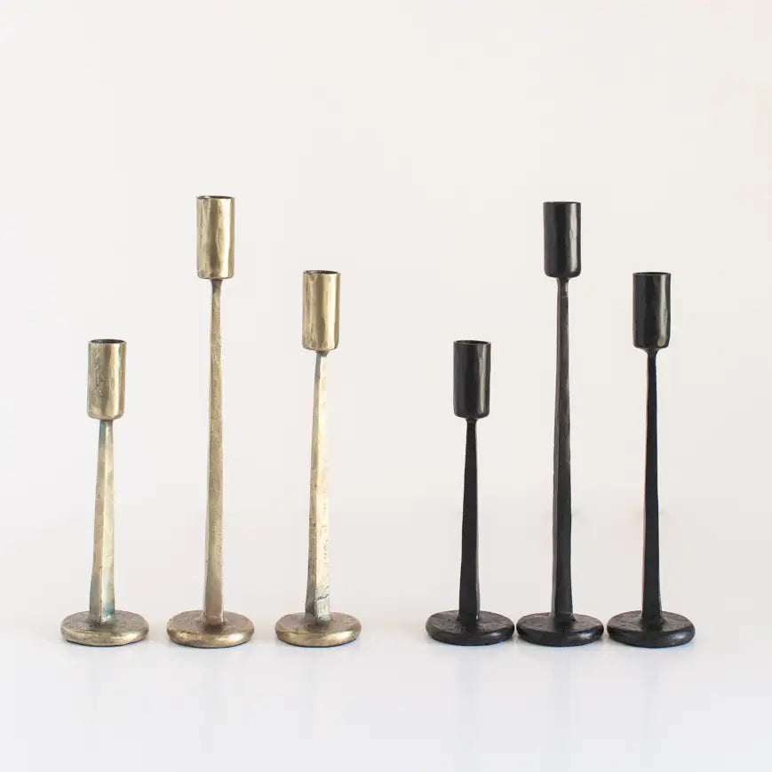 Set of vintage black iron candlesticks with sleek designs for elegant home decor