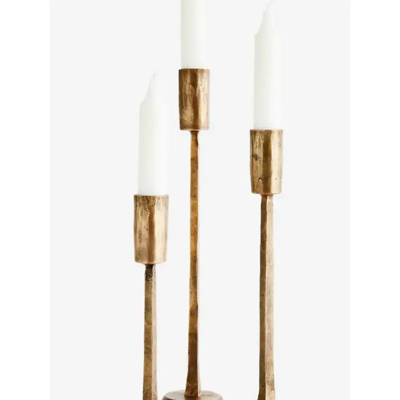 Elegant vintage black iron candlesticks with three tapered candles for a classic home decor look