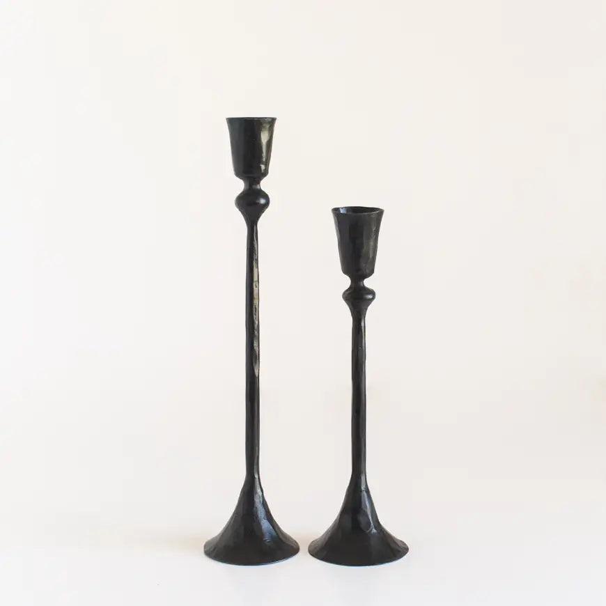 Set of vintage style metal candlesticks in black with elegant, tall designs for home decor