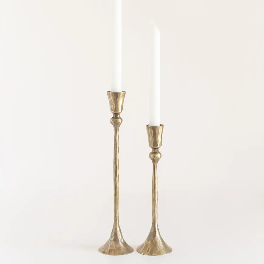 Set of vintage style metal candlesticks featuring elegant design for home decor